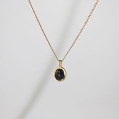 Looking for anything minimal? The tiny black onyx necklace won't take too much attention away from your whole look but it adds just right much black charm to your style. 18k gold plated Stainless steel base Waterproof and tarnish free 16" + 2" extender Black 14k Gold Tarnish Resistant Necklace, Black 14k Gold Tarnish-resistant Necklace, 14k Gold Black Tarnish-resistant Necklace, Minimalist Black Enamel Necklaces, Dainty Black Tarnish-resistant Jewelry, Black Tarnish-resistant Charm Necklace As Gift, Minimalist Black Enamel Necklace, Black Round Pendant Necklace, Gold Plated, Minimalist Gold Necklace With Black Enamel