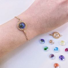 this dainty bracelet has been carefully handcrafted and can come in your choice of birth flower, there are perfect and special gift for everyone  ❤️ M E A S U R E M E N T S  : -  LENGTH: Approx. 19cm + 5cm extender - If you would like another length, please leave a note with your order with the length you require ❤️M A T E R I A L : - Eco resin. - Pressed flowers -  14K Gold wire ❤️ A B O U T Me All pieces are designed and made by me in Australia. I am in love with the wild botanical, Therefore Adjustable Flower Bracelets As Gift For Her, Adjustable Flower Bracelet As A Gift For Her, Adjustable Flower Bracelet Gift For Her, Bohemian Adjustable Bracelets With Flower Charm, Adjustable Bohemian Bracelets With Flower Charm, Bohemian Adjustable Bracelet With Flower Charm, Adjustable Bohemian Bracelet With Flower Charm, Spiritual Flower-shaped Bracelets For Gift, Spiritual Flower Bracelets For Gifts