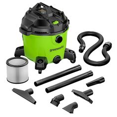 a green and black vacuum is shown with its attachments, tools and cleaning supplies