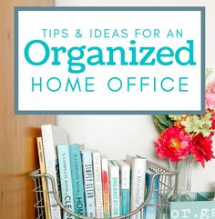 an organized home office with flowers and books