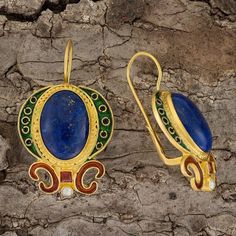 Pride of The Museum of Jewelry. Italian jewelers were particularly renowned during the late Renaissance as their colorful creations elevated jewelry to new creative heights. Here, a indigo blue lapis is regally set against crescents of green and black enamel, accented with a garnet and pearl. Size 1 1/2 inches. Luxury Royal Blue Jewelry, Blue Temple Jewelry Earrings For Gift, Traditional Round Lapis Lazuli Jewelry, Traditional Blue Cabochon Jewelry, Elevated Jewelry, Garnet And Pearl, Horse Sweater, Lapis Earrings, Rhodolite Garnet