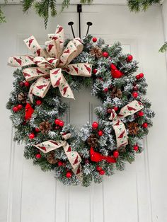 a christmas wreath hanging on the front door