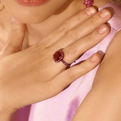 A dramatic ring in 18 karat gold with black rhodium centers a 5.09 carat cushion cut rubellite tourmaline accented with 1.58 total carats of round brilliant cut red spinels. Reference Code: 30198 Shop other beautiful pieces in our Ring Collection For inquiries on the piece please contact: boutique@shsilver.com Luxury Red Ruby Ring With Gemstone Accents, Red Spinel Ring, Red Spinel, Rubellite Tourmaline, Spinel Ring, Ring Collection, Black Rhodium, Halo Rings, Ring Collections