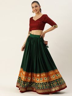 Get ready to turn heads this festive season with our alluring Green Patola Print Silk Festival Wear Lehenga Choli. This exquisite piece is designed to make you stand out and be the center of attention at any occasion or celebration.
The lehenga itself features a vibrant combination of green and maroon colors, creating a stunning visual impact. Made from fine tussar silk, the lehenga has a 3.40 meter flair, giving it a graceful and elegant silhouette. The stitching is impeccable, ensuring a perfe Semi-stitched Choli With Pallu For Diwali, Festive Semi-stitched Bandhani Print Choli, Bollywood Floor-length Choli For Diwali, Bollywood Semi-stitched Choli For Diwali, Semi-stitched Bandhani Print Choli For Festive Occasions, Anarkali Lehenga With Unstitched Blouse For Navratri, Bollywood Lehenga With Unstitched Blouse For Navratri, Traditional Drape Semi-stitched Skirt For Festivals, Semi-stitched Floor-length Self Design Choli