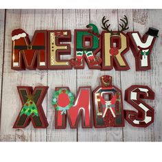 the words merry xmas are made out of wooden letters and decorated with christmas decorations