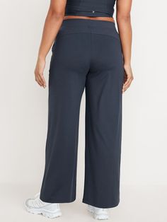 elasticized waist hip pockets seamed front leg pockets fit your phone go-dry wicks moisture pull-on style sits at belly button loose hip and thigh wide leg 30 1/2" regular inseam 28 1/2" petite inseam 33 1/2" tall inseam models are approx.  5'9" and wear sizes s (4), l (12), and xl (18)machine wash according to the care instruction label Wide Leg Activewear With Pockets And 4-way Stretch, Casual Solid Yoga Bottoms, Wide-leg Yoga Pants With Pockets For Loungewear, Casual Full Length Yoga Pants With Comfort Waistband, Comfortable Full-length Bottoms, High Waist Comfort Waistband Bottoms For Loungewear, High Waist Bottoms With Comfort Waistband For Loungewear, Casual High Waist Bottoms With Contoured Waistband, Comfortable Stretch Wide Leg Pants With Pockets