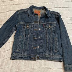 Levi’s Denim Jacket Never Worn Great Condition Levi's Denim Jacket With Button Closure For Fall, Vintage Levi’s Button-up Denim Jacket, Levi's Dark Wash Outerwear With Button Closure, Levi's Denim Fall Outerwear, Levi's Denim Outerwear For Fall, Levi's Medium Wash Outerwear With Button Closure, Levi's Dark Wash Fall Outerwear, Levi's Dark Wash Denim Jacket For Fall, Levi's Dark Wash Outerwear For Fall