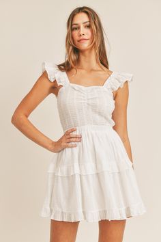 -Color: Off White -Sleeveless -Dotted swiss -Ruffle tier -Smocked bodice -Content: Self 100% Cotton; Lining 100% Rayon -Hand wash/Line dry -Imported -Model is 5'9" and wearing a size Small Cotton Smocked Dress With Ruffled Straps, Summer Tiered Dress With Smocked Bodice For Daywear, Fitted Sleeveless Tiered Dress With Ruffles, Sleeveless Cotton Tiered Dress For Daywear, Sleeveless Smocked Bodice Tiered Sundress, Sleeveless Tiered Sundress With Smocked Bodice, Casual Tiered Dress With Smocked Bodice And Ruffled Straps, Summer Smocked Tiered Dress, Summer Smock Tiered Dress