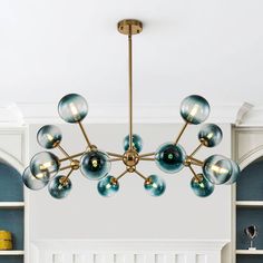 a chandelier hanging from the ceiling in a living room