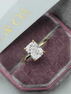 This astonishing 3.19 carats ring has a 3 carat lab grown elongated cushion cut center diamond and is IGI certified at "E" in color and "VS1" in clarity, (Excellent Cut, Polish and Symmetry) and is set in a classy solitaire hidden halo setting in 14K yellow gold. Comes with IGI certification, appraisal and our lifetime warranty as well. Elongated Cushion Engagement Rings, Elongated Cushion Engagement Ring Gold, Elongated Cushion Engagement Ring, Promise Rings For Girlfriend, Cushion Cut Solitaire, Elongated Cushion Cut, Ring Cuts, Elongated Cushion, Cushion Cut Moissanite