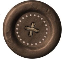 a metal object with a cross on the center and holes in it's middle