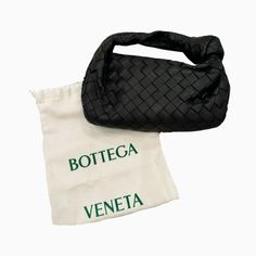 Bottega Veneta Mini Jodie Bag Black Excellent Condition - Only Worn Once! Top Handle Bag In Lambskin Leather With Soft Rounded Shape And Signature Knot Made Using Intrecciato Craftsmanship Mini Intrecciato Leather Top Handle Bag Single Compartment Zipper Closure Comes With Original Dustbag Material: 100% Lambskin Lining: Calfskin Color: Black Hardware: Gold Finish Height: 23 Cm | 9.1" Width: 28 Cm | 11" Depth: 8 Cm | 3.15" Handle Drop: 10 Cm | 3.9" Made In: Italy ***Do Not Bundle Listings Priced At $500 And Over - Sale Will Be Cancelled*** Black Top Handle Pouch For Shopping, High-end Black Shoulder Bag For Errands, Designer Black Shoulder Bag Pouch, Luxury Handheld Pouch For Shopping, Designer Black Baguette Pouch Bag, Designer Black Pouch Baguette Bag, Designer Black Top Handle Pouch, High-end Black Pouch Bag, Luxury Handheld Shopping Pouch