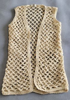 a crocheted vest sitting on top of a table