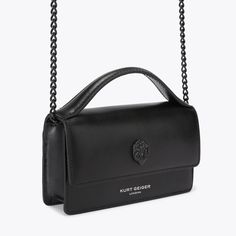 The Extra Small Bond Top Handle Purse is made from a textured leather in black. There is a black eagle head which sits on the front flap and embossed branding below.3.5in (H), 5.9in (L), 1.3in (D)Strap length: 48.4inOptional black chain cross body strap Fits classic credit cardsFlat open pocket on the backInterior: Monogrammed interior liningExterior: LeatherStyle number: 2746500109 Black Textured Leather Crossbody Flap Bag, Formal Black Wallet On Chain With Magnetic Closure, Black Leather Wallet On Chain For Business, Black Business Clutch Wallet On Chain, Black Business Wallet On Chain Clutch, Black Wallet On Chain For Business, Black Rectangular Wallet On Chain With Magnetic Closure, Black Leather Wallet On Chain With Detachable Strap, Black Leather Wallet On Chain With Removable Pouch