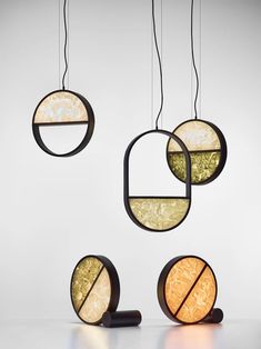 three circular light fixtures hanging from the ceiling