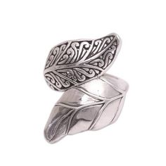 Crafted of sterling silver a beautiful leaf with intricate curling patterns is displayed alongside a traditional leaf in this cocktail ring from Bali. Dewa Arimbawa designs and crafts the ring. Elegant Silver Leaf Shaped Ring, Elegant Silver Leaf-shaped Ring, Elegant Sterling Silver Leaf-shaped Jewelry, Sterling Silver Leaf-shaped Jewelry, Nickel-free Silver Leaf Shaped Jewelry, Silver Leaf-shaped Adjustable Jewelry, Bohemian Leaf-shaped Metal Jewelry, Traditional Weaving, Domed Ring