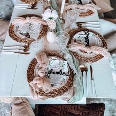 a table set with plates, napkins and silverware