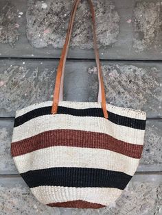 A beautiful brown and white stripes handbag made of sisal with leather handles.Made of extrafine grain sisal.Great for a day out or a gift to loved one.DimensionsLargeShipmentShips via DHLTakes 3-7 days depending with the destinationWholesale ordersAvailableCustom ordersAvailableThank you so much for shopping with us! Striped Rectangular Straw Bag For Daily Use, Striped Bag With Leather Handles For Everyday Use, Striped Rectangular Straw Bag With Braided Handles, Striped Rectangular Bag With Braided Handles, Striped Rectangular Bag With Adjustable Strap, Everyday Striped Straw Bag With Braided Handles, Striped Rectangular Bag With Leather Handles, Brown Bucket Straw Bag For Shopping, Striped Rectangular Beach Bag For Everyday Use