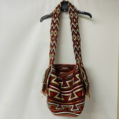 - Red, Brown, Tan, And White - Handwoven Bucket Style Bag -Wear Shoulder Or Cross-Body -Drawstring With Tassels -100% Acrylic Yarn And Glass Crystals -Handmade In Columbia -Comes With Extra Crystals -Comes With Luxchilas Logo Bag Red Woven Satchel Bag, Handmade Red Bucket Bag For Travel, Handmade Red Bucket Shoulder Bag, Red Woven Shoulder Bag For Travel, Red Crochet Tote Bag For Travel, Red Woven Satchel Shoulder Bag, Handwoven Red Shoulder Bag For Travel, Red Handwoven Shoulder Bag For Travel, Red Handwoven Satchel Bag