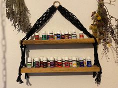 an assortment of essential oils displayed on wooden shelves