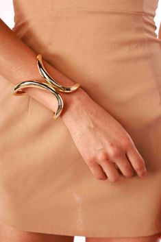 Add a touch of boldness to your ensemble with the Tall Hinged Cuff. Its unique shape and elegant hinge design create a striking statement that enhances any look. Bracelet type: Hinge cuff Flexible Metal Bangle For Formal Occasions, Elegant Metal Open Cuff Bracelets, Modern Evening Cuff Bracelet Bangle, Modern Evening Cuff Bangle Bracelet, Adjustable Open Cuff Jewelry For Party, Chic Cuff Jewelry For Evening, Party Open Cuff Bracelet, Bold Party Bracelet Jewelry, Chic Evening Bangle Jewelry