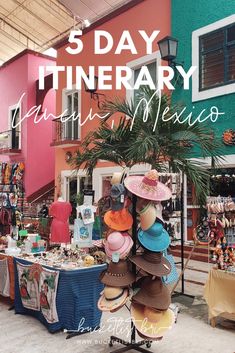 there are many hats on display in this store with the words 5 day itinerary written above them