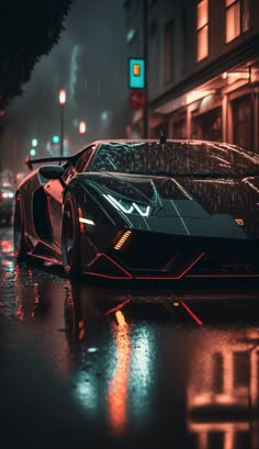 a very nice looking sports car on the street in the rain at night with its lights on