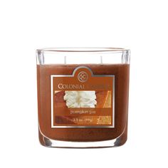 a candle that is sitting in front of a white background with the words colonial confection written on it