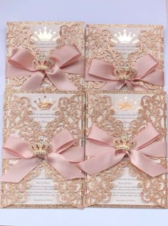 the wedding card is decorated with pink satin ribbons and a crown on it's back