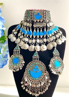 Afghan light blue vintage 3 piece jewellery set, Afghan jewellery  Set includes: -1 pair of earrings  -1 chocker necklace  -1 tikka  Message for any enquiries Our Aim as a business is to connect Afghan women with their roots and to make anyone that purchases our jewellery feel powerful and beautiful as each and everyone of our items is handcrafted with care and love. Vintage Blue Choker Jewelry, Bohemian Light Blue Jewelry For Festivals, Vintage Light Blue Handmade Jewelry, Vintage Turquoise Jewelry For Festivals, Blue Handmade Vintage Choker, Vintage Blue Handmade Choker, Blue Vintage Necklace For Festival, Vintage Light Blue Jewelry For Wedding, Vintage Light Blue Wedding Jewelry