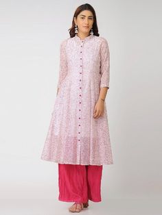 An Ivory and pink blockprinted chanderi kali dress with a separate cambric tunic Features: Front open 12 kali jacket dress with 3/4th sleeves Shell - pure cotton silk fabric Lining - separate matching slip in soft cotton Hand block printed in Pink Handmade in India Garment measurements (in Inches): Size XS : Bust-34", Waist-29", Hip-Flared, Shoulder-14", Length-47", Sleeve length-17" Size S : Bust-36", Waist-31", Hip-Flared, Shoulder-14.5", Length-47", Sleeve length-17" Size M : Bust-38", Waist- White Cotton Silk Salwar Kameez For Spring, Spring Pink Chanderi Kurta, White Cotton Silk Kurta With Block Print, Pink Anarkali Kurta With Block Print, Spring Pink Kurta With Cutdana, Pink Anarkali Set With Block Print Straight Kurta, Pink Cutdana Kurta For Spring, Spring Cotton Silk Pink Kurta, Spring Pink Cotton Silk Kurta