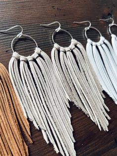 Adjustable Bohemian Earrings For Parties, Trendy Single Earring For Festivals, Bohemian Silver Fringe Earrings, Silver Fringe Bohemian Earrings, Silver Bohemian Fringe Earrings, Bohemian Everyday Earrings For Summer, Trendy Festival Drop Earrings, Trendy Tassel Dangle Earrings For Festival, White Bohemian Hoop Earrings For Party