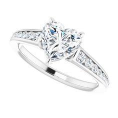 This delicate ring features 1/5 ctw. of dazzling diamonds that adorn the band. A 0.2 ct. or larger heart, asscher, oval, cushion, pear, round, emerald or square shape stone can be set with this ring. White Moissanite Diamond Ring With Heart Cut, White Heart Cut Diamond Ring With Prong Setting, White Heart Cut Moissanite Diamond Ring, Heart Cut Moissanite Ring With Diamond Accents, Lab Grown Diamond Heart Cut Ring For Anniversary, Heart Cut Lab Grown Diamond Ring For Anniversary, Anniversary Heart Cut Lab Grown Diamond Ring, Cubic Zirconia Diamond Ring With Brilliant Heart Cut, Valentine's Day Diamond Ring With Center Stone, Round Cut