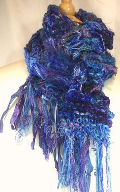 a blue and purple scarf on a mannequin