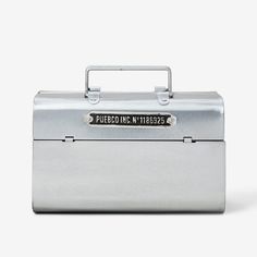 a silver lunch box with a metal handle