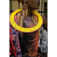 Our beautiful authentic Maasai Collar necklace (in yellow with a red rim) is handmade out of Maasai glass beads and wire by the Maasai women in Tanzania. Our collars are created entirely by hand and no two are the same. Variations in size and design may occur. Each piece tells a story. Beaded jewelry is part of the Maasai identity and through our collection, we tell their stories and preserve the traditions of this unique tribe. Maasai women are skilled artisans who are known worldwide for their Yellow Beaded Necklaces With Large Beads For Festivals, Yellow Beaded Necklace With Large Beads For Festivals, Festive Yellow Necklace With Gold Beads, Handmade Red Beaded Necklaces For Traditional Ceremonies, Artisan Yellow Beaded Necklaces For Festivals, Handmade Beaded Necklaces For Ceremonial Occasions, Yellow Polished Beads Jewelry For Festival, Traditional Gold Bead Necklaces For Ceremonies, Yellow Round Beads Jewelry For Celebration