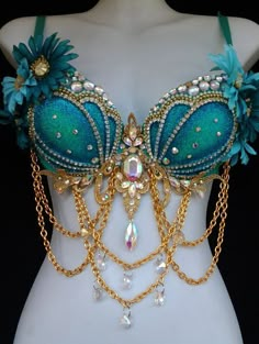 a green bra with chains and flowers on it