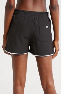 A '90s-inspired lace-up closure and dolphin hem bring some extra fun to these stretchy, high waist board shorts featuring built-in sun protection for the win. 2 1/2" inseam Zip fly with snap closure; lace-up closure Front slant pockets; back patch pocket with drainage grommet UPF 50+ sun protection 92% recycled polyester, 8% spandex Machine wash, tumble dry Imported Black Bottoms With Built-in Shorts For Beach Season, Sports Bottoms For Summer With Short Length, Summer Sports Bottoms With Short Length, Sporty Short Bottoms For Summer, Sporty Summer Bottoms, Casual Swimming Bottoms With Adjustable Waist, Casual Bottoms With Adjustable Waist For Swimming, Sporty High-waisted Shorts For Summer, Sporty Bottoms With Short Inseam For Poolside