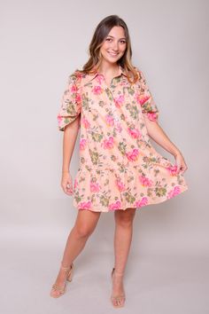 Step into summer with our Peachy Breeze Dress—a charming addition to your wardrobe that embodies the essence of blooming tropic and gentle breezes. Crafted from a lightweight printed woven fabric, this mini dress features a classic shirt collar and short puff sleeves, evoking a sense of vintage-inspired elegance. Self: 100% Polyester Lining: 100% Polyester Hand Wash Cold Colors may vary with different viewing devices. Summer Vacation Floral Print Shirt Dress, Summer Floral Print Shirt Dress, Summer Vacation Shirt Dress With Floral Print, Breezy Short Sleeve Mini Dress, Pink Puff Sleeve Floral Dress For Summer, Breezy Short Sleeve Mini Dress For Spring, Spring Floral Print Dress With Collared Neckline, Summer Floral Print Collared Dress, Pink Floral Print Shirt Dress For Summer