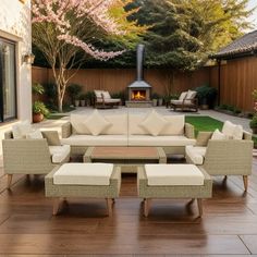 an outdoor living area with furniture and a fire place