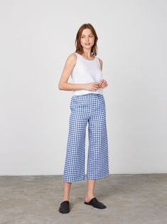 "RILEY is a wide leg cropped linen culottes. DETAILS - Cropped length - Seam pockets - Wide leg - Elasticated waist - 100% lightweight European linen fabric - Cut and sewn to order just for you in our studio COLOR - Blue Gingham, you can also choose other colors above - Fabric samples are available here https://www.etsy.com/listing/586569696/linen-fabric-samples SIZING & FIT - Fits true to size - Model is 5'10\" / 178cm and wearing a size XS CARE FOR LINEN - Machine wash up to 30ºC/86ºF gentle cycle - Lay flat to dry or tumble dry low - Warm iron if needed - Do not bleach SIZE GUIDE Size conversion guide Size XS (US 0-2, IT 36-38, UK 4-6, Japan 3-5, France 32-34) Size S (US 4-6, IT 40-42, UK 8-10, Japan 7-9, France 36-38) Size M (US 8-10, IT 44-46, UK 12-14, Japan 11-13, France 40-42) Size Wide Leg Summer Capris For Loungewear, Wide Leg Cotton Capris, Spring Cropped Wide Leg Loungewear Pants, Relaxed Fit Cropped Bottoms For Summer, Summer Cropped Wide Leg Pants With Pockets, Summer Wide Leg Cropped Pants With Pockets, Spring Cotton Wide Leg Culottes, Spring Wide Leg Cropped Pants For Loungewear, Spring Cropped Wide Leg Lounge Pants