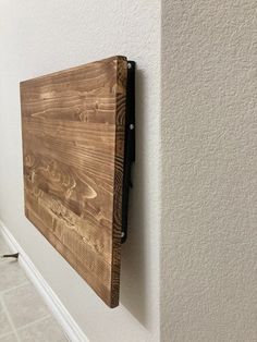 a wooden board mounted to the side of a wall