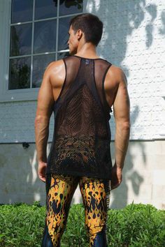 Perfect for those hot summer days and late-night dance parties, this mens mesh tank top features paneling in different mesh fabrics for a unique, eye-catching look. Crafted from high-quality, super breathable mesh materials, this see through fishnet top will keep you cool and comfortable all day (and night) long. The black color gives it a sleek and versatile appearance, while the mixed mesh paneling adds a touch of edginess and style. Whether you're looking to stand out in the crowd or just wan Summer Club Tops With Racerback, Summer Club Racerback Top, Summer Club Top With Racerback, Summer Racerback Top For Club, Summer Gym Racerback Vest, Summer Racerback Gym Vest, Stretch Athleisure Vest For Summer, Breathable Summer Tank Top, Breathable Sleeveless Tank Top For Summer