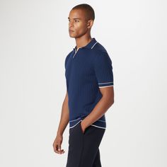 Crafted in a durable blend of cotton and polyester, this rib-stitch short-sleeved polo sweater showcases a solid flat knit Johnny collar, armbands, and waist. Soft against the skin with comfort stretch and added strength for lasting wear, it strikes the perfect balance between comfort and durability. Fitted Ribbed Short Sleeve Polo Shirt, Modern Short Sleeve Cotton Polo Sweater, Modern Cotton Short Sleeve Polo Sweater, Relaxed Fit Short Sleeve Polo Sweater With Ribbed Collar, Relaxed Fit Polo Sweater With Ribbed Collar, Fitted Navy Polo Sweater With Ribbed Collar, Ribbed Cotton Short Sleeve Polo Shirt, Navy Short Sleeve Polo Sweater With Ribbed Collar, Fitted Blue Polo Sweater With Short Sleeves