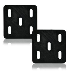 two black plastic plates with holes in the middle