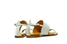 Sophisticated summer attitude in white elegant strappy sandals. There is no more to say, just wear your new pair of sandals and enjoy the summer. This pair of sandals are ultimate in everyday casual, perfect balance between beach-ready and urban appropriate. Hand crafted from the softest leather and cushioned for extra comfort and with wide straps they make the most comfortable fit. This sandals are perfect choice for every day or night of the summer. Style yours with everything from dresses to Elegant T-strap Sandals With Round Toe For Summer, Elegant T-strap Sandals With Flat Heel For Vacation, Elegant Slingback Sandals With Round Toe For Vacation, Elegant T-strap Sandals With Ankle Strap For Summer, Elegant Round Toe Slingback Sandals For Vacation, White Slingback Sandals With Round Toe For Summer, Modern Open Toe T-strap Sandals For Summer, Modern Summer Slingback Sandals With Ankle Strap, Modern White Strappy Sandals