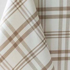 two tan and white checkered sheets on top of each other