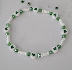 St. Patrick's Day beaded bracelet with Charms and Letter Beads, St. Patrick's Day, Stretch Bracelet This bracelet is made with custom sizing.  You choose from 6 to 8 inches. if you need a smaller or larger size please message me the details. Listing includes ONE bracelet. Any images shown with multiple bracelets is to be used as an example of how they can be stacked with other Bracelets. ALL ORDERS ARE FINAL SALE. THESE ARE CUSTOM BRACELETS MADE TO ORDER. PLEASE DOUBLE CHECK SIZE SELECTIONS PRIOR TO CHECKOUT.  CARING TIPS:  - Do not expose jewelry to water - Treat and store jewelry gently - Roll bracelets on rather than stretching band to get on. The beads used for this bracelet are small (8/0 Glass Seed Beads) and should not be used for children under 4 years old.  Please don't let the ch Concert Bead Bracelets, Beaded Bracelet With Letters, Double Beaded Bracelet Diy, Cute Beaded Bracelets Words, Basic Beaded Bracelet, Cute Small Bead Bracelet Ideas, Fun Beaded Bracelets, Bracelet Small Beads, St Patricks Day Bracelet