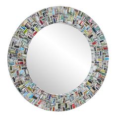 a round mirror made out of magazines on a white background with the reflection in it