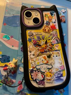 an iphone case with many stickers on it